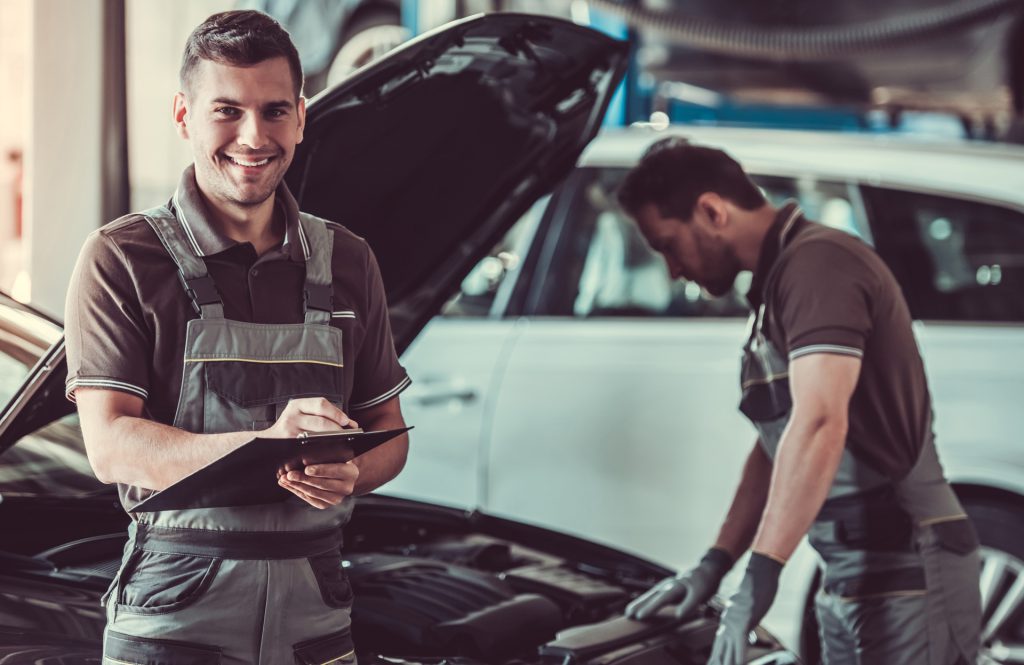 Mechanic looking over a vehicle - MOT Testing Huntingdon