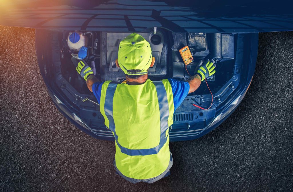 Car Mechanic Servicing Vehicle. Broken Modern Car with Open Hood. Car Repair - Mobile Mechanic Huntingdon